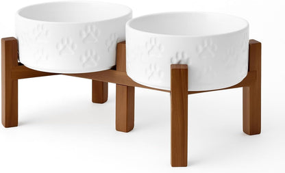 SPUNKYJUNKY Ceramic Elevated Dog Bowl Set with Acacia Wood Stand for Food and Water for Small Medium Sized Dogs (28.74 OZ, White, Dog Paw Pattern)