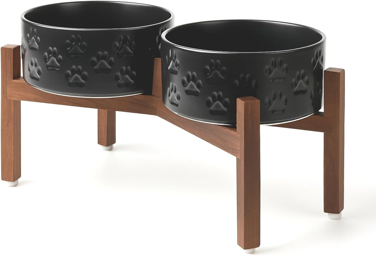 SPUNKYJUNKY Ceramic Elevated Dog Bowl Set with Acacia Wood Stand for Food and Water for Medium Dogs (42.27 OZ, Black, Dog Paw Pattern)
